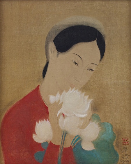 Portrait of a young woman with lotus branc